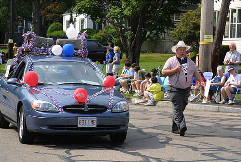 Singer and decorated car