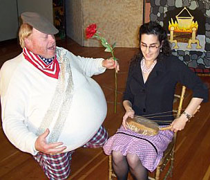 Falstaff kneeling to Alice Ford